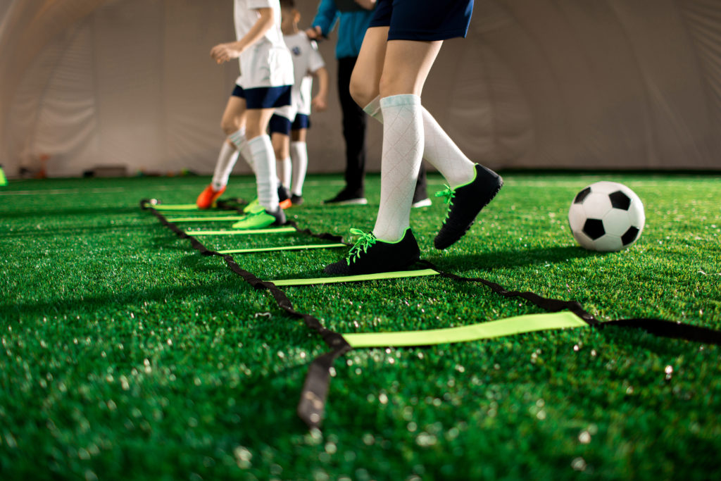 Young soccer players at an indoor sports facility